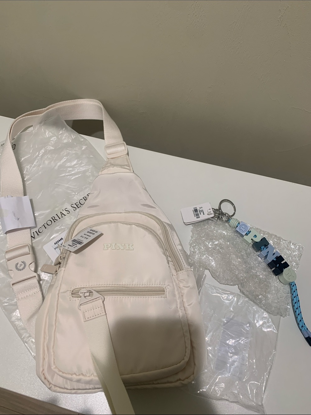PINK Cream Small Sling Bag & Blue keychain combo